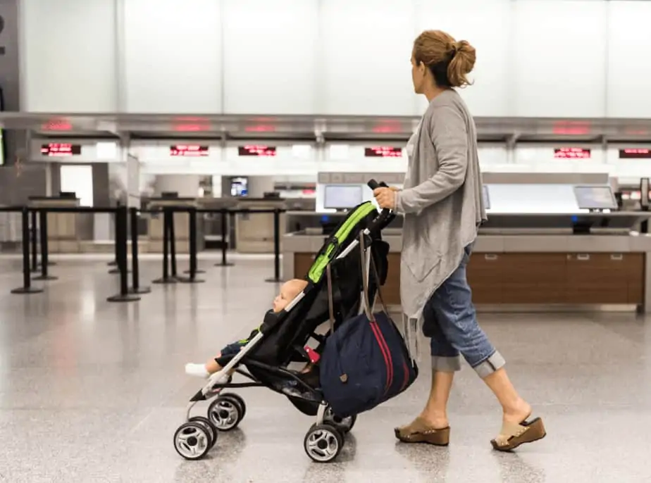 mom with the stroller in the airport